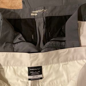 Men’s nike golf pants.  dri fit.  2 pairs grey and tan size 28/32